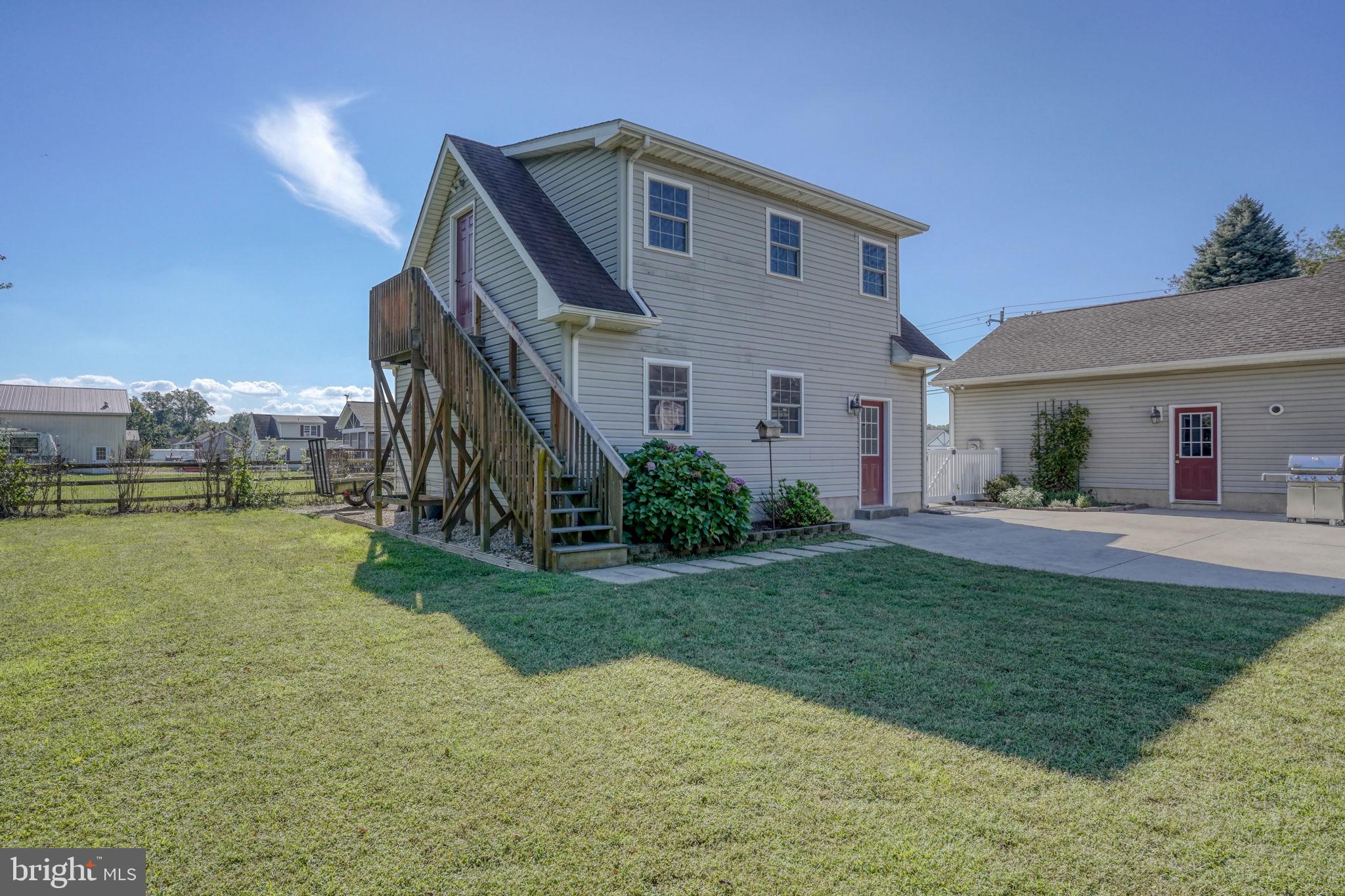 6420 Pearsons Corner Road Dover, DE 19904 - Photo 47 of 54 a front view of a house with garden