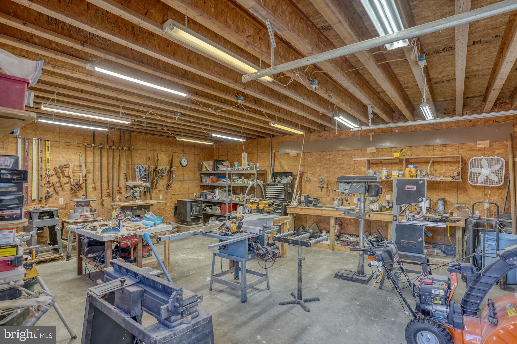 6420 Pearsons Corner Road Dover, DE 19904 - Photo 48 of 54 a view of a storage room with racks on the wall