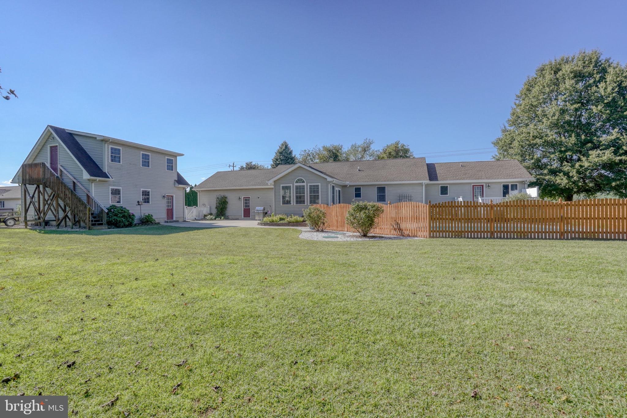 6420 Pearsons Corner Road Dover, DE 19904 - Photo 49 of 54 a front view of a house with a yard