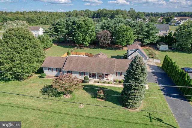 an aerial view of residential house with outdoor space and lake view