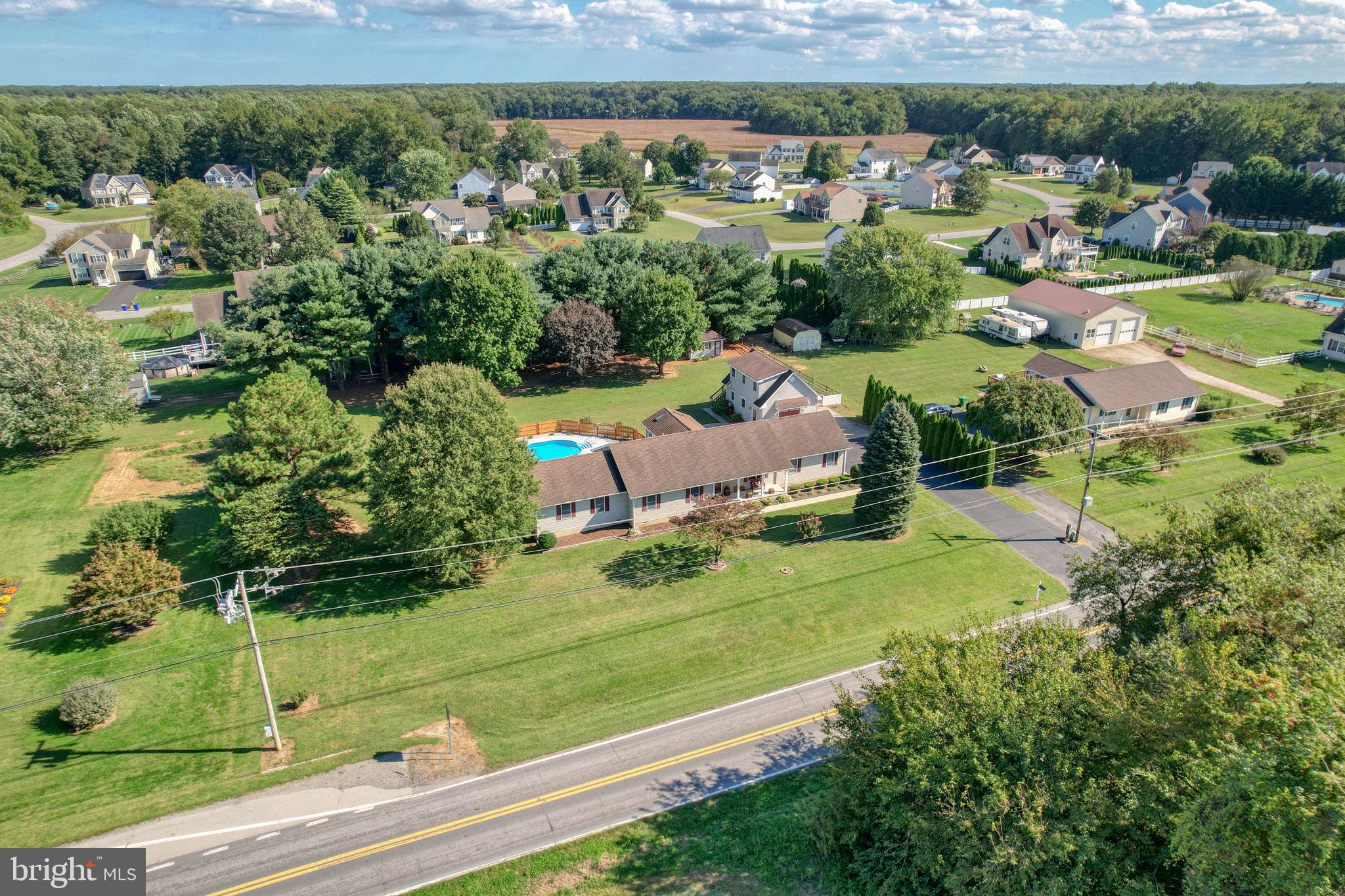 6420 Pearsons Corner Road Dover, DE 19904 - Photo 9 of 54 an aerial view of a house with a yard