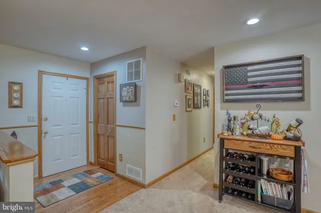 a living room with fireplace furniture and a flat screen tv