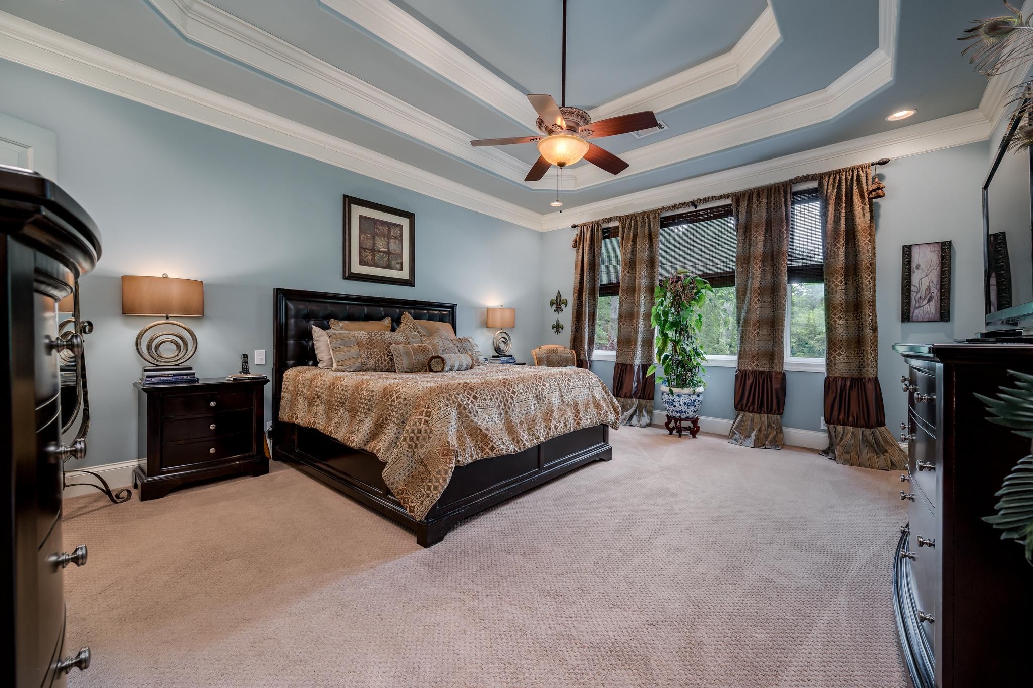 6201 Windrow Road Rockvale, TN 37153 - Photo 17 of 49 a bedroom with a bed and a chandelier