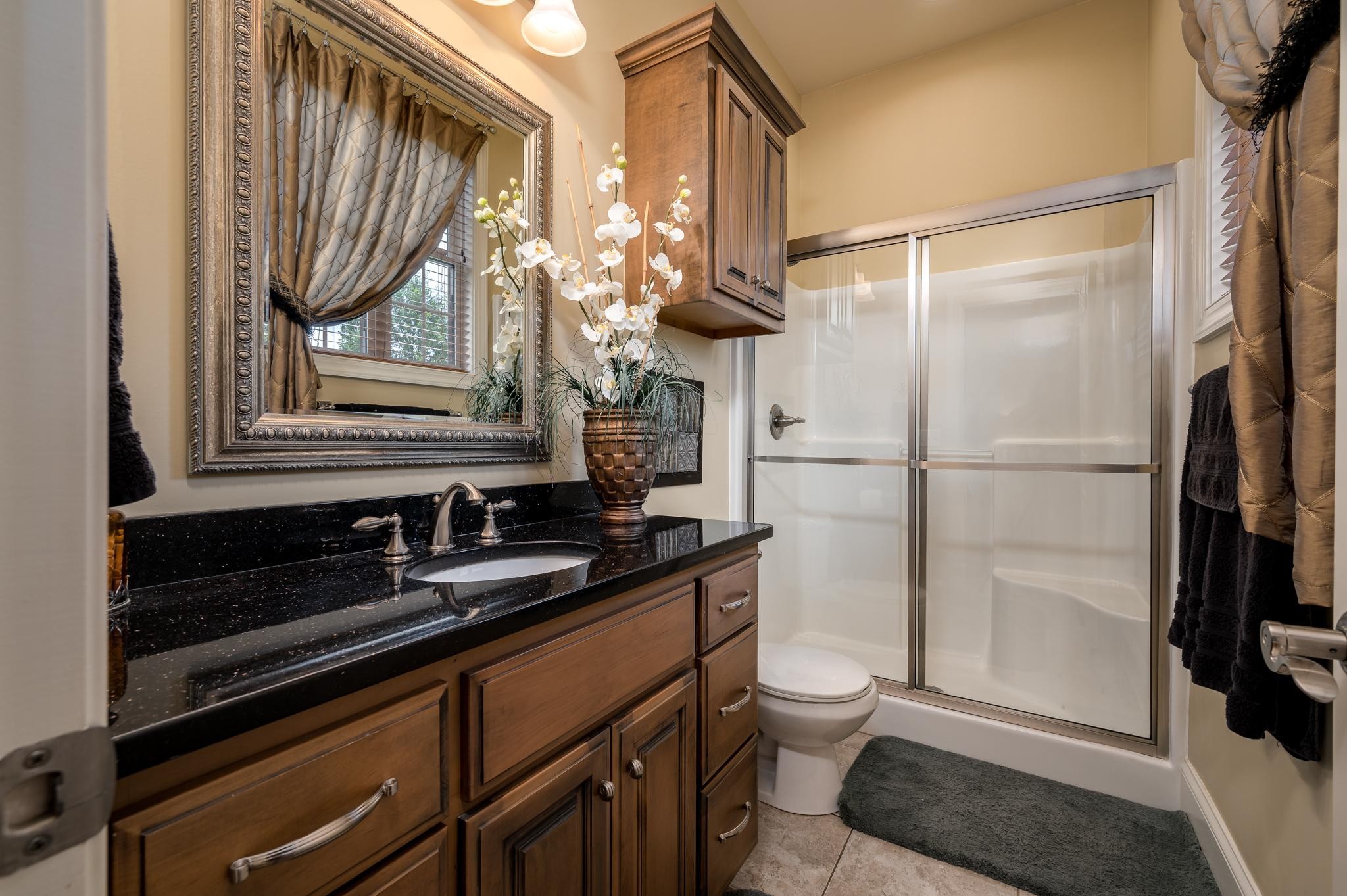6201 Windrow Road Rockvale, TN 37153 - Photo 25 of 49 a bathroom with a sink a toilet and a mirror