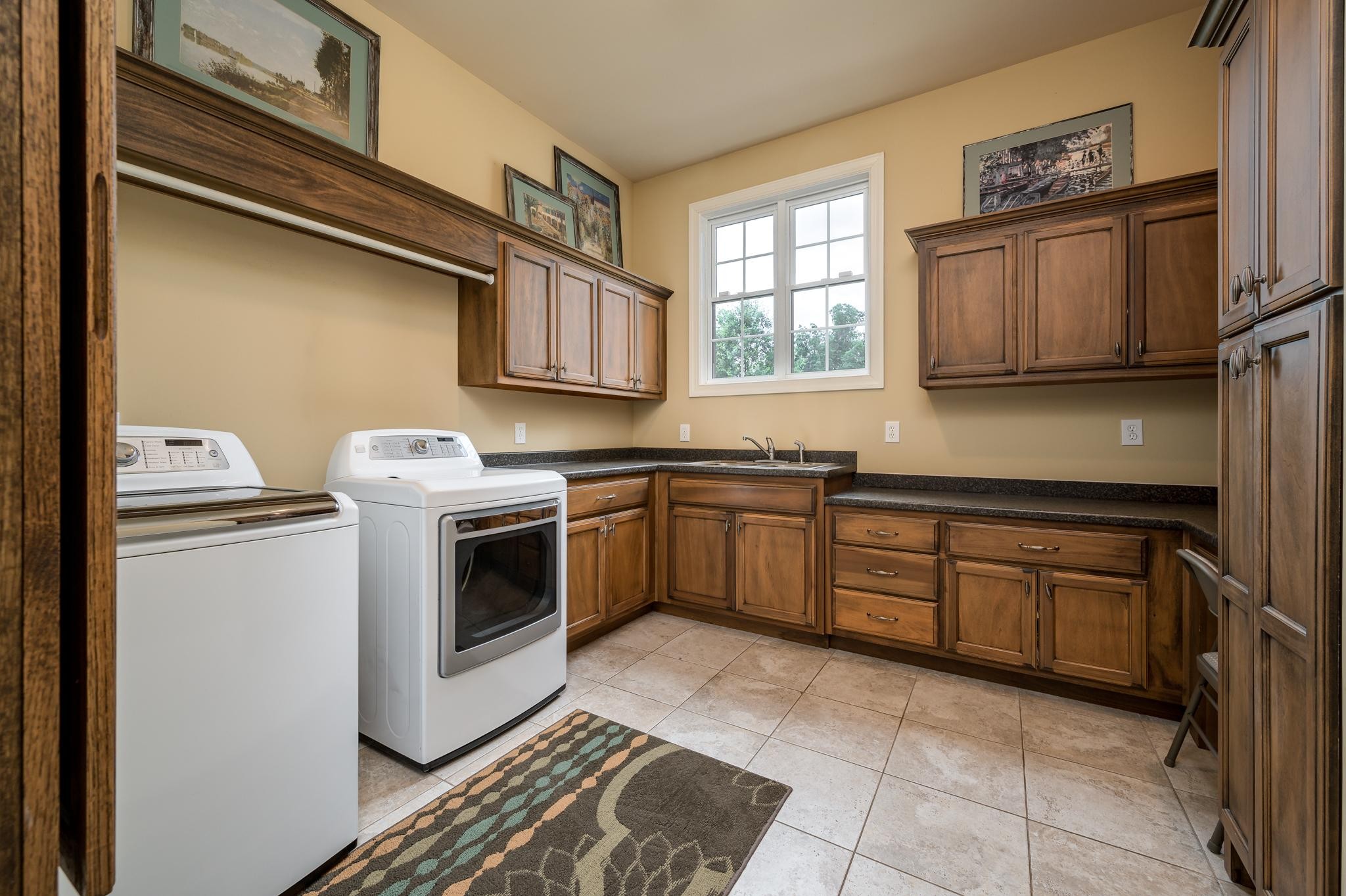 6201 Windrow Road Rockvale, TN 37153 - Photo 26 of 49 a kitchen with stainless steel appliances granite countertop a sink a stove a microwave a sink and cabinets