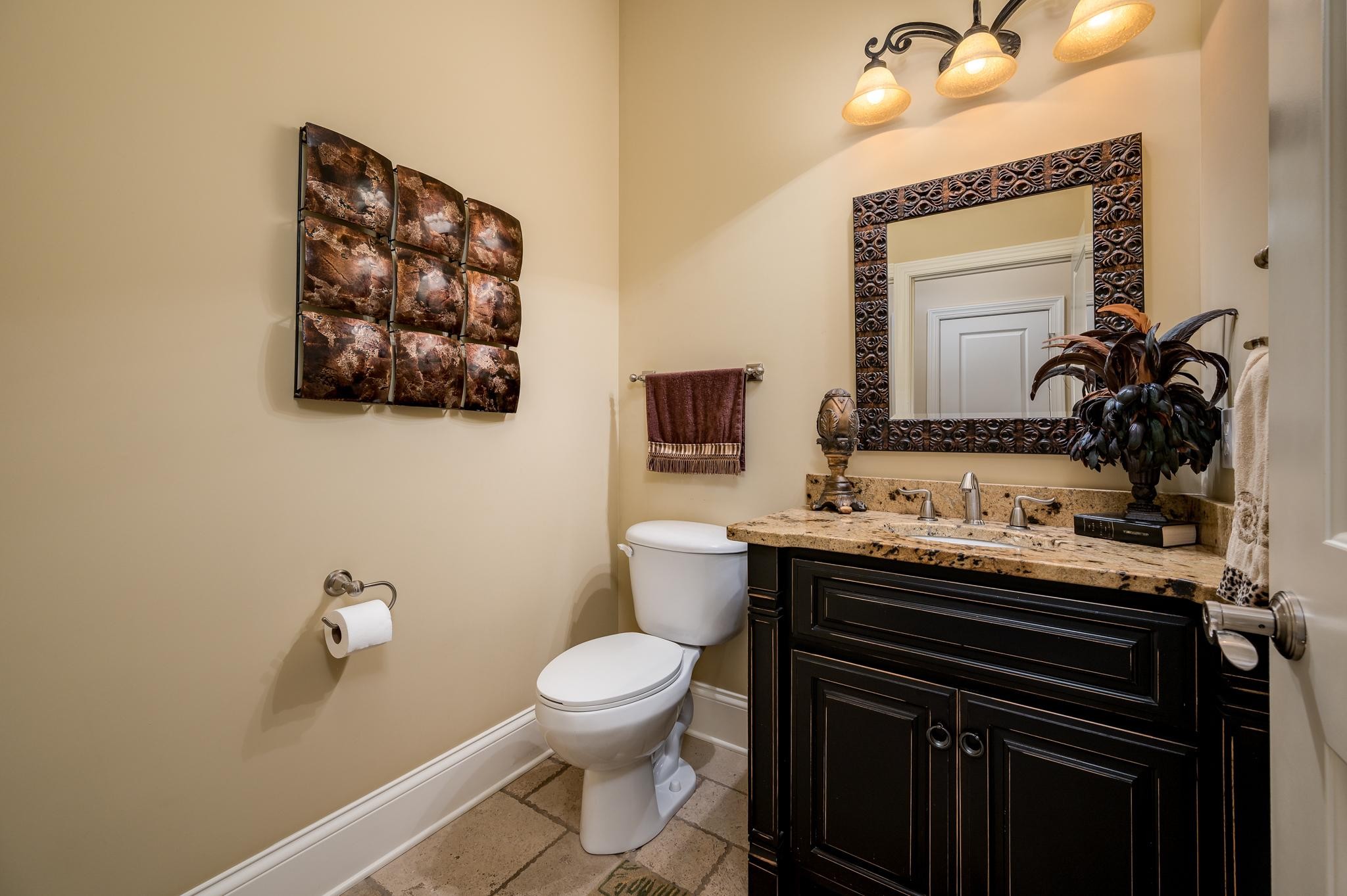 6201 Windrow Road Rockvale, TN 37153 - Photo 27 of 49 a bathroom with a toilet a sink and mirror