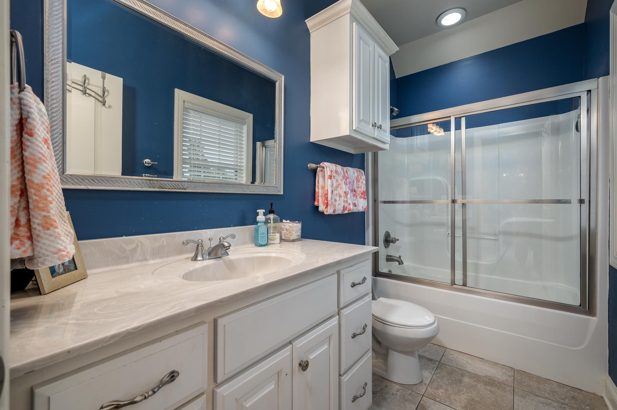 6201 Windrow Road Rockvale, TN 37153 - Photo 32 of 49 a bathroom with a toilet sink and mirror