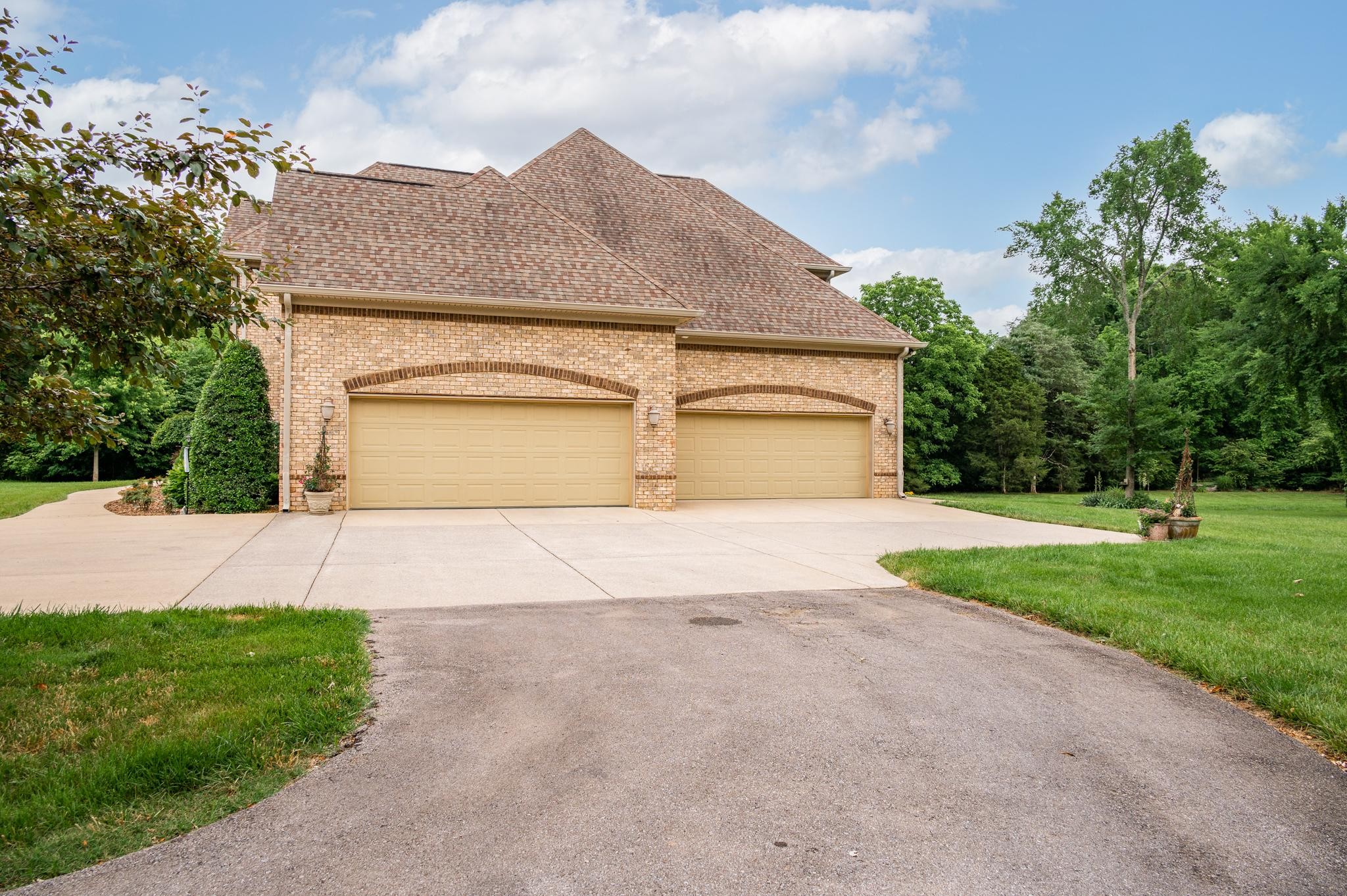 6201 Windrow Road Rockvale, TN 37153 - Photo 38 of 49 a front view of a house with a yard and garage