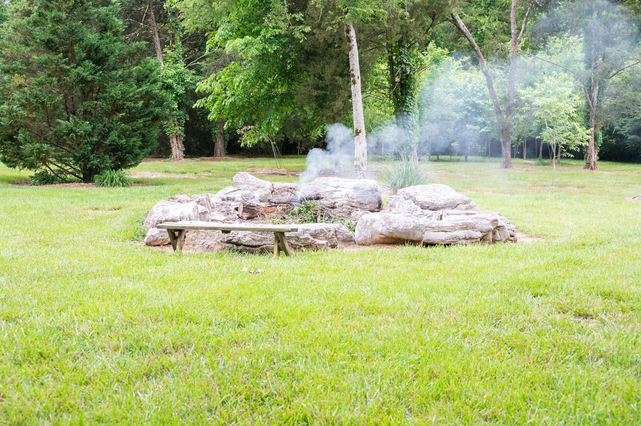 6201 Windrow Road Rockvale, TN 37153 - Photo 41 of 49 a backyard of a house with table and chairs