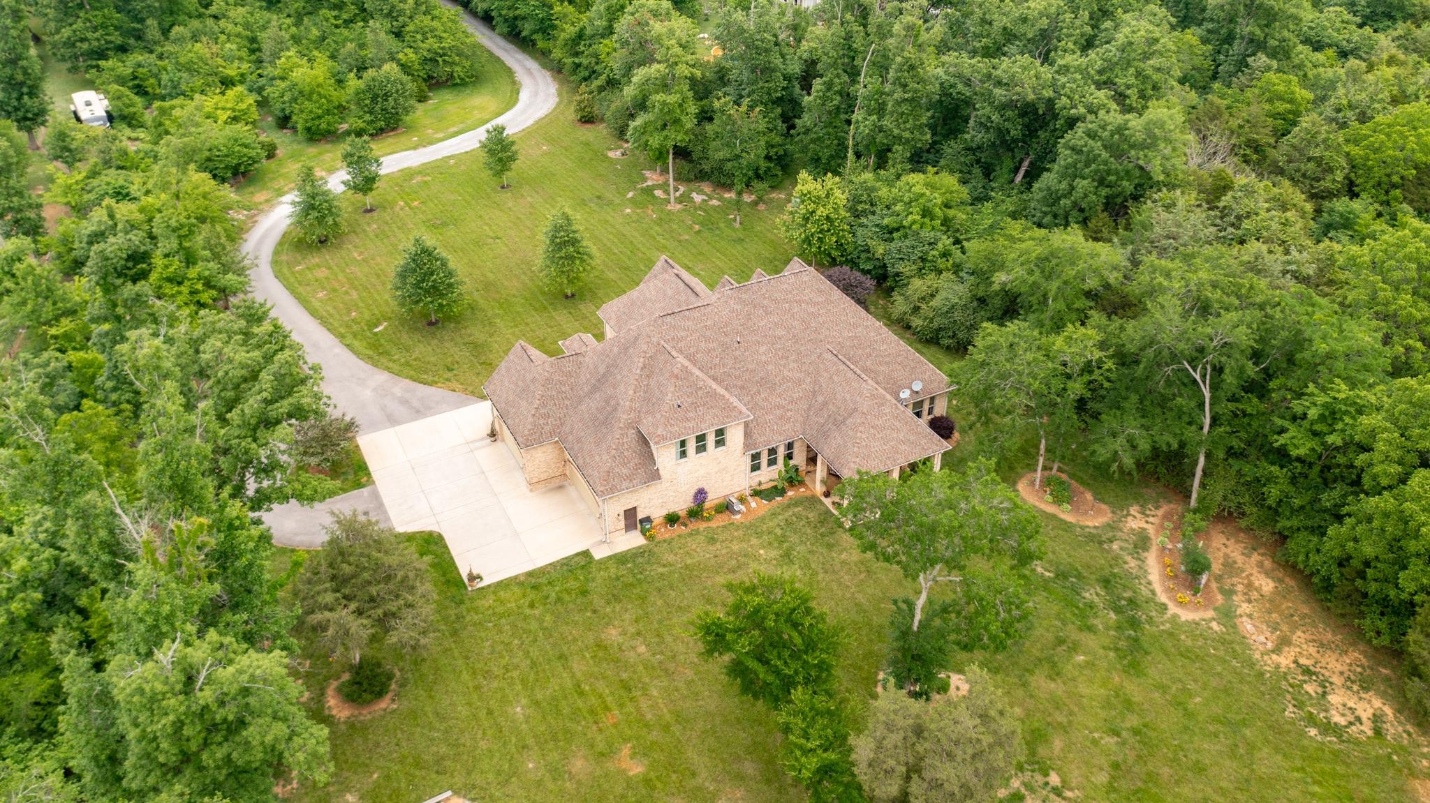 6201 Windrow Road Rockvale, TN 37153 - Photo 43 of 49 an aerial view of a house with a yard and large trees