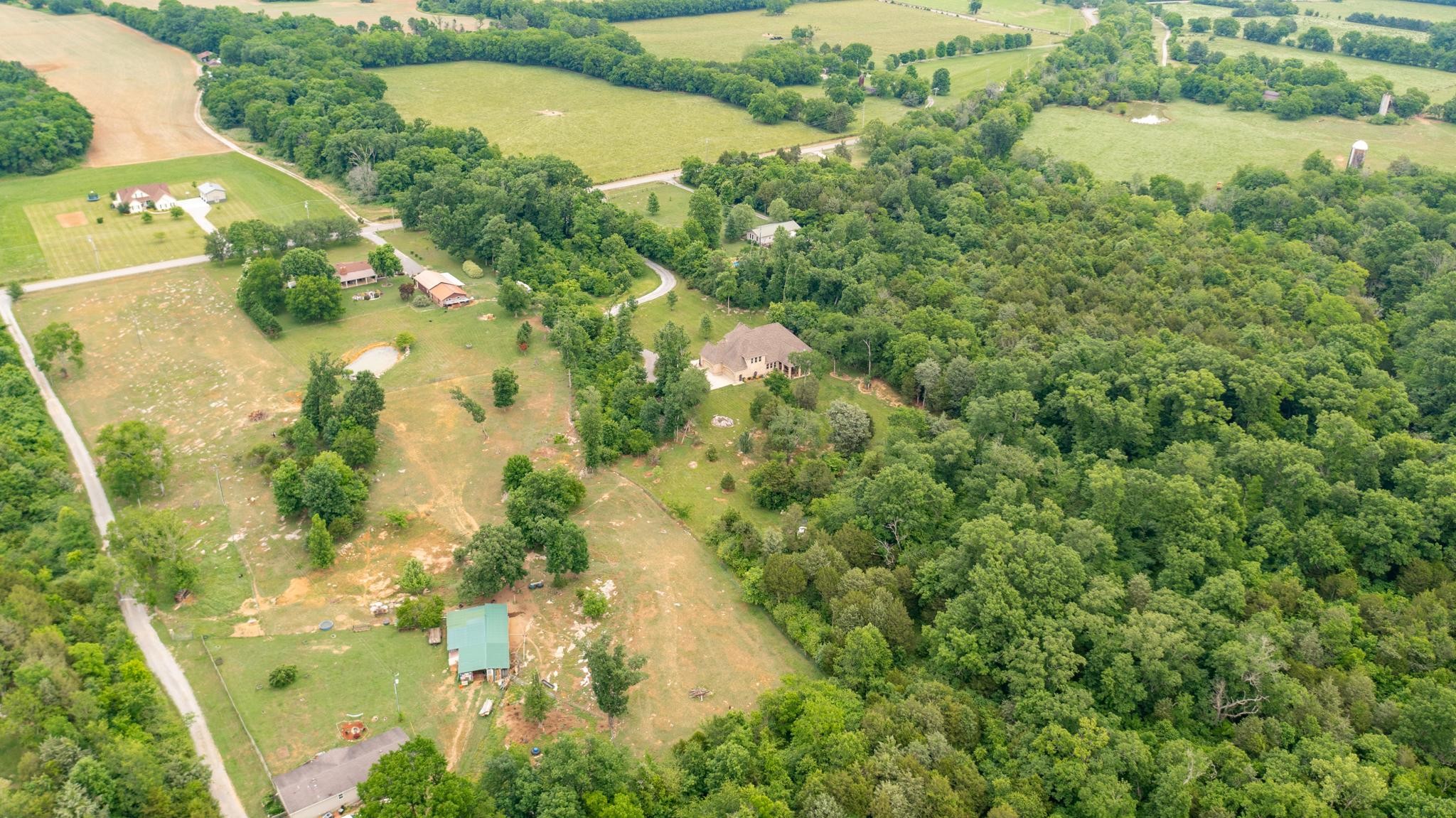 6201 Windrow Road Rockvale, TN 37153 - Photo 45 of 49 an aerial view of residential houses with outdoor space and trees all around