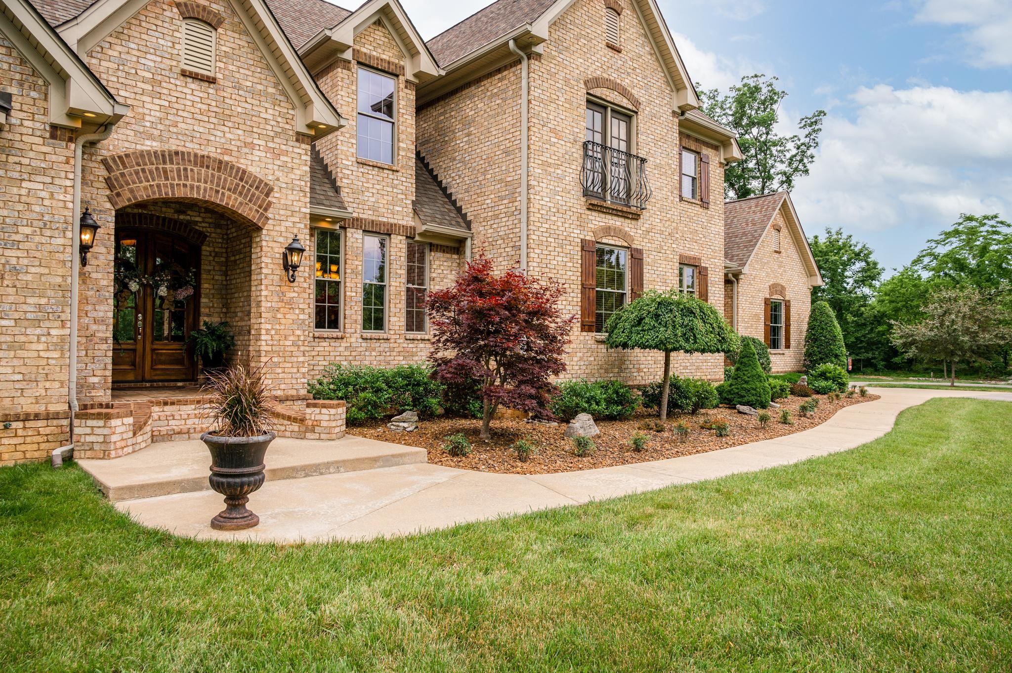 6201 Windrow Road Rockvale, TN 37153 - Photo 49 of 49 a front view of a house with a yard garage and outdoor seating