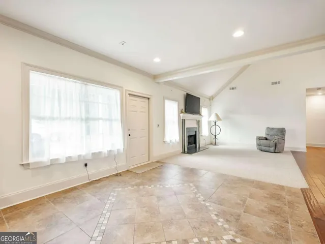 a view of an empty room with a window