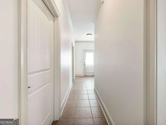 a view of a hallway with a white walls