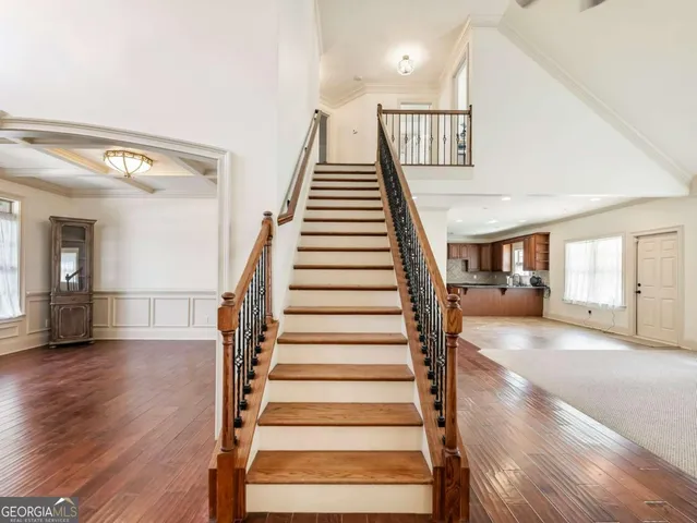 a view of entryway and hall with wooden floor
