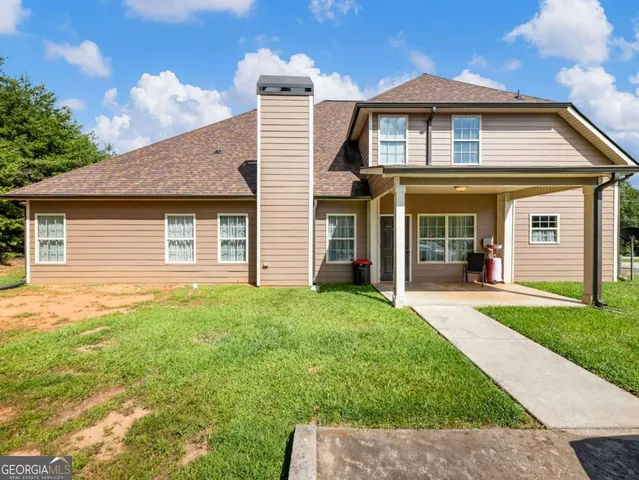 front view of a house with a yard