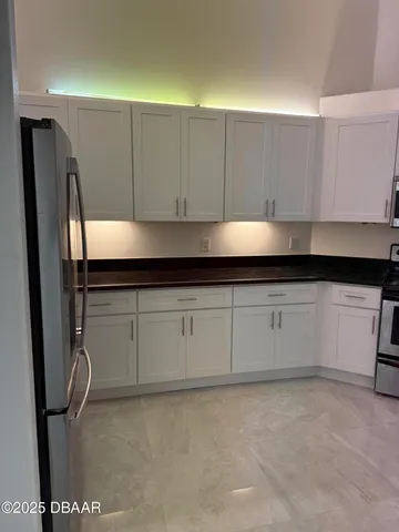 a view of a chandelier fan in a room