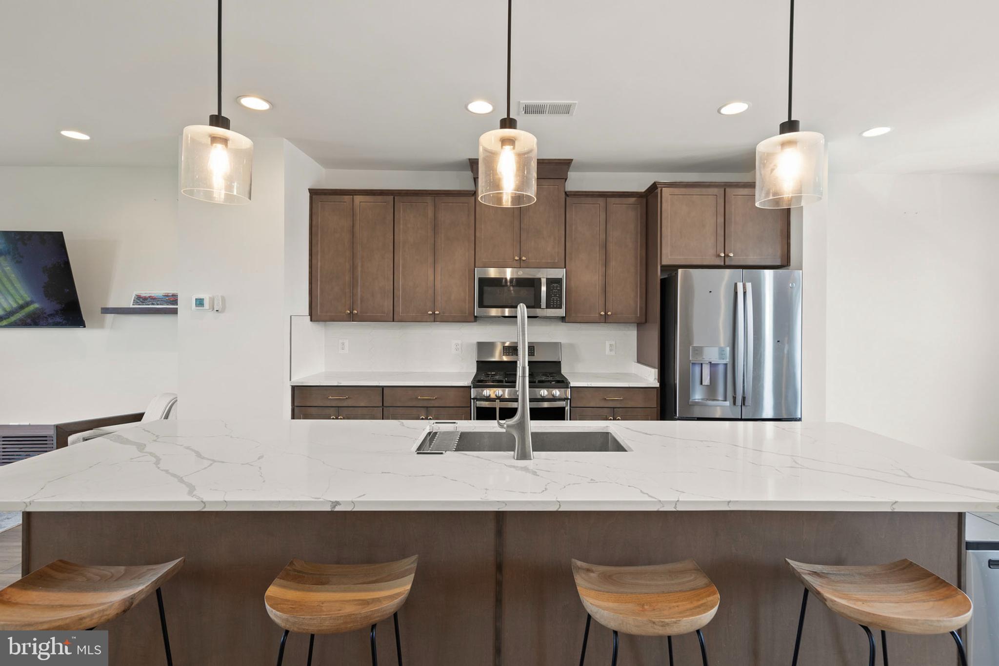 102 Phacelia Way Lake Front Royal, VA 22630 - Photo 11 of 29 a kitchen with a table chairs sink and microwave
