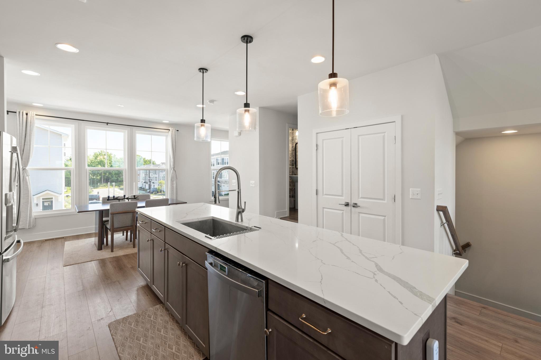 102 Phacelia Way Lake Front Royal, VA 22630 - Photo 13 of 29 a kitchen with a sink a counter space and a dining table
