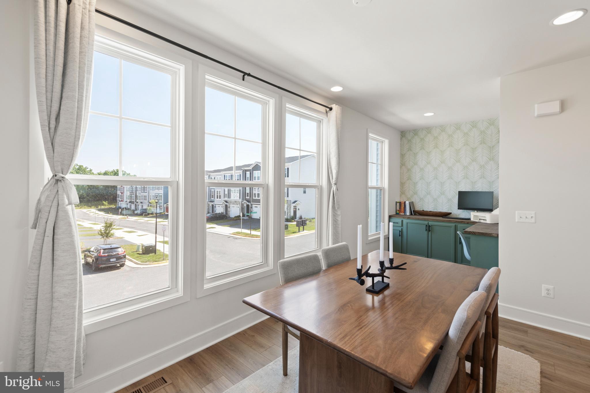 102 Phacelia Way Lake Front Royal, VA 22630 - Photo 14 of 29 a view of a dining room with a table and chairs