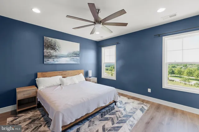 a bedroom with a large bed and a window