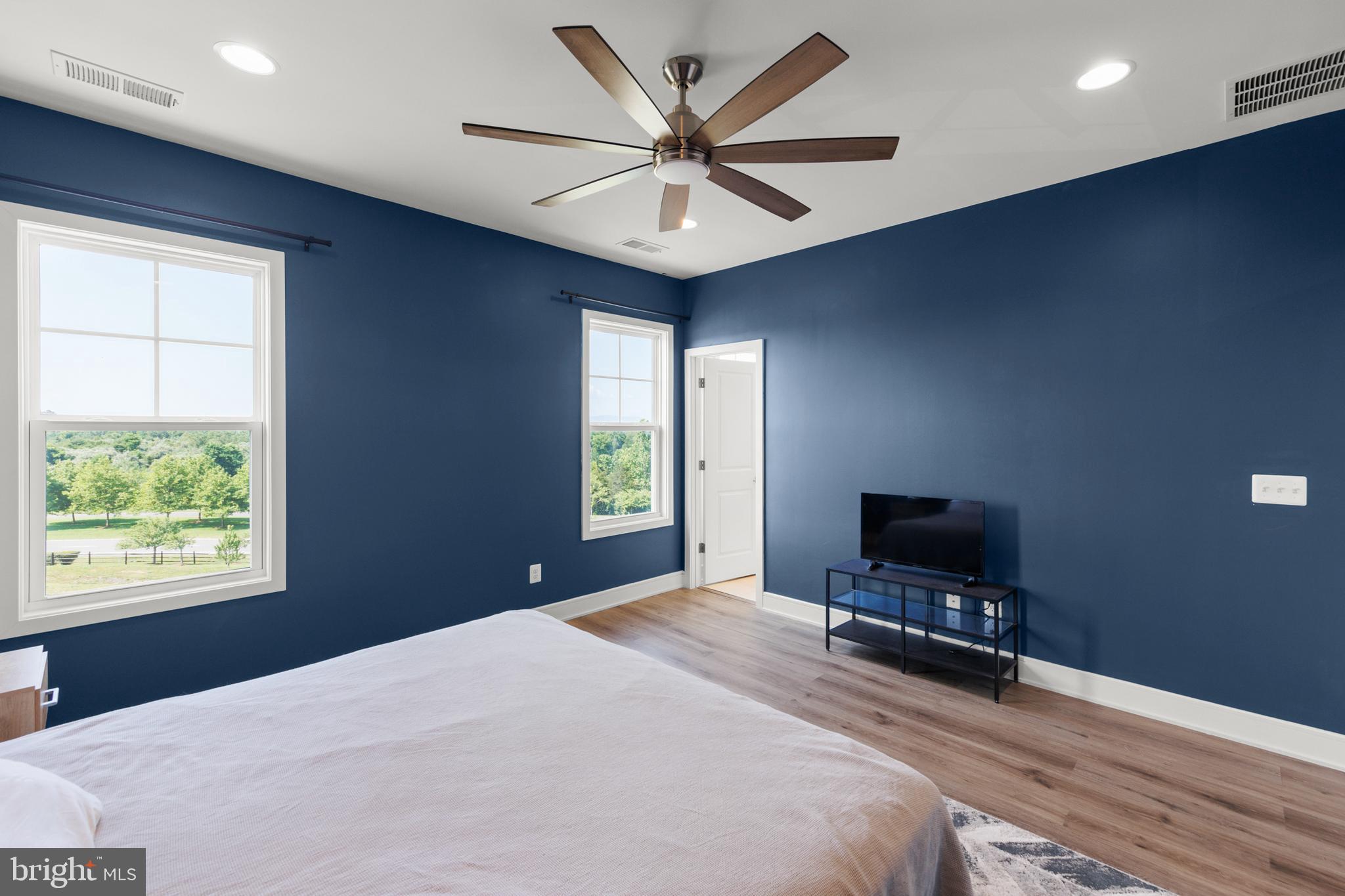 102 Phacelia Way Lake Front Royal, VA 22630 - Photo 18 of 29 a bedroom with a bed window and a flat screen tv