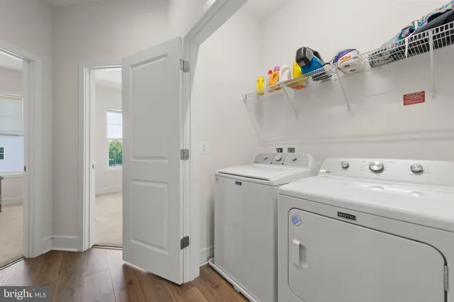 an empty room with fan and windows