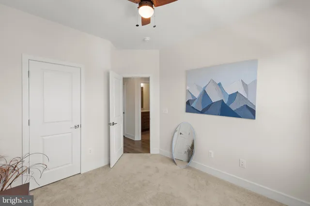 an empty room with windows and closet