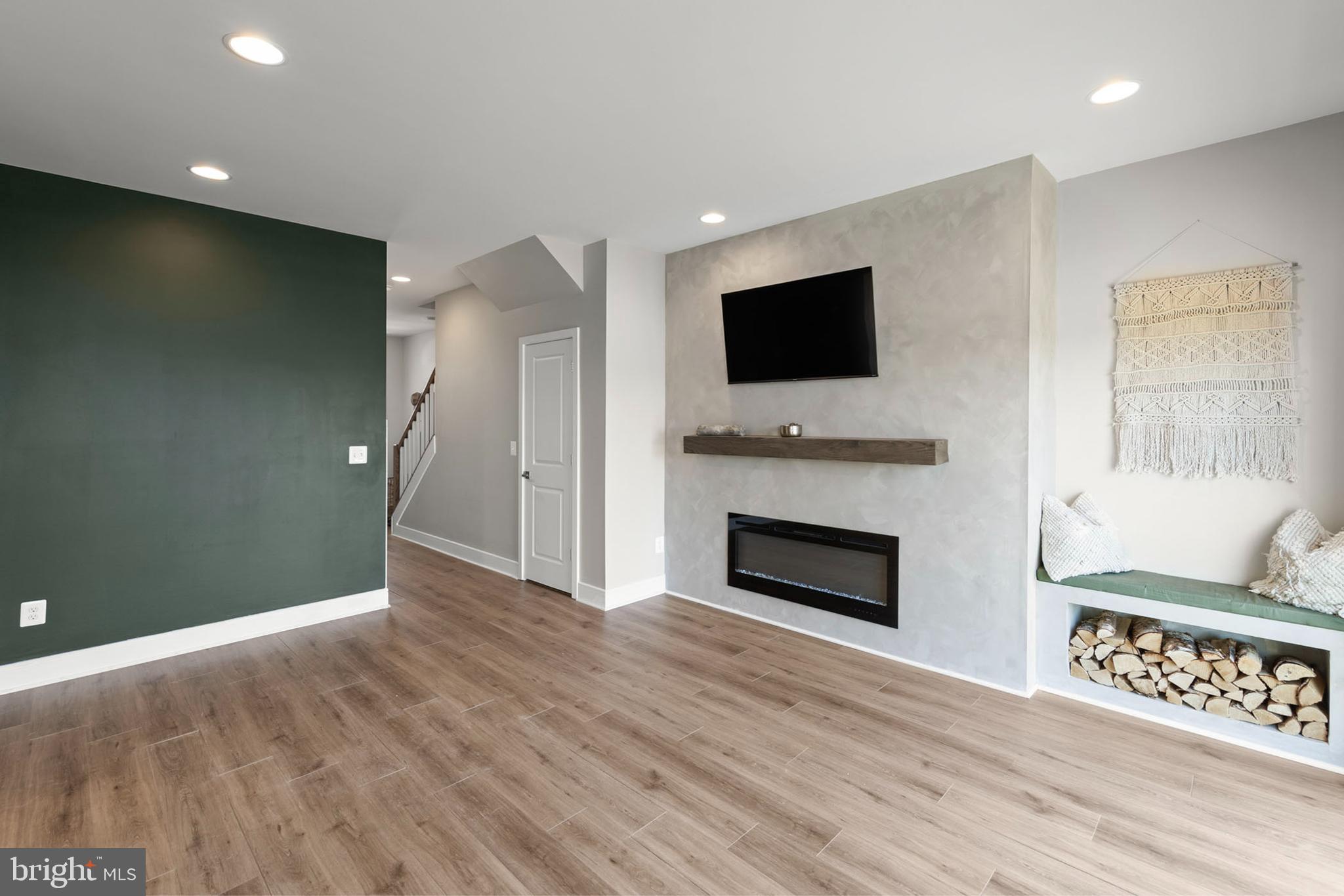 102 Phacelia Way Lake Front Royal, VA 22630 - Photo 4 of 29 a view of an empty room with wooden floor and a window