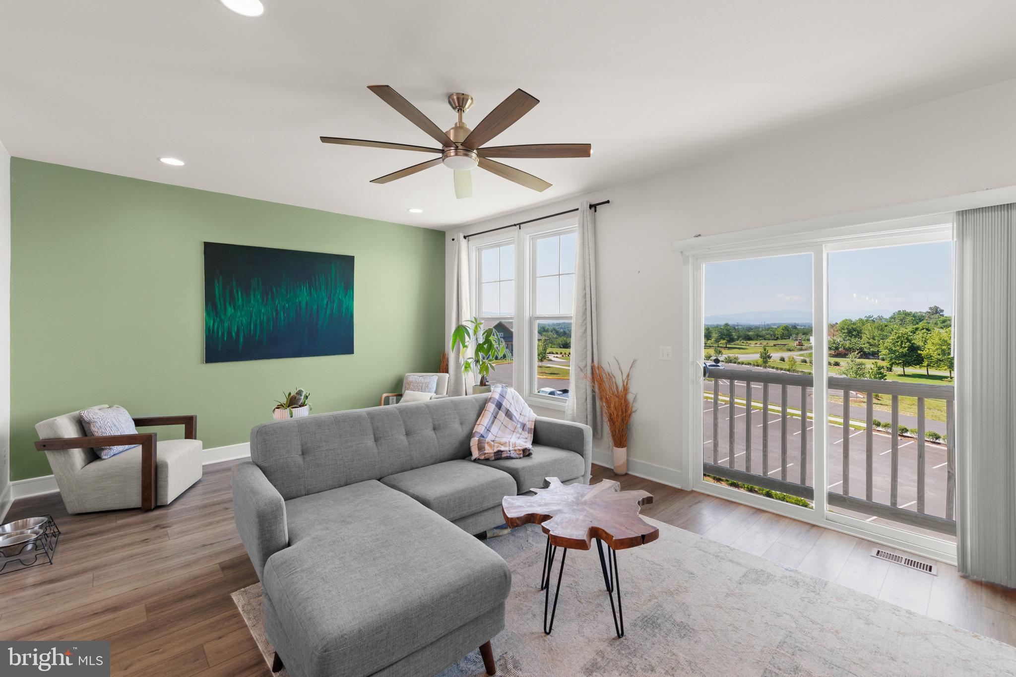 102 Phacelia Way Lake Front Royal, VA 22630 - Photo 8 of 29 a living room with furniture and a flat screen tv