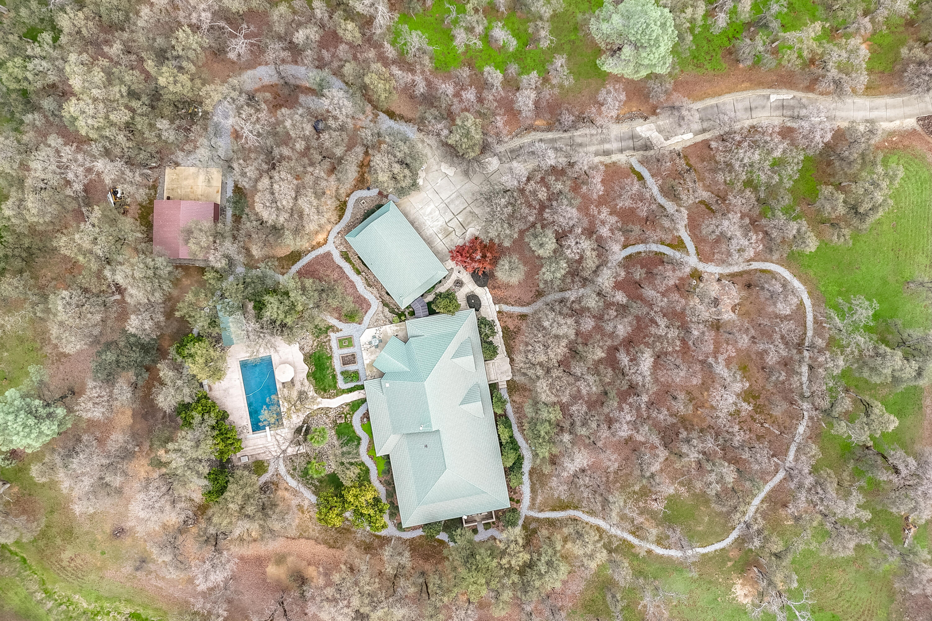 15900 El Camino Robles Road Redding, CA 96001 - Photo 112 of 117 a aerial view of a house with a yard and large trees