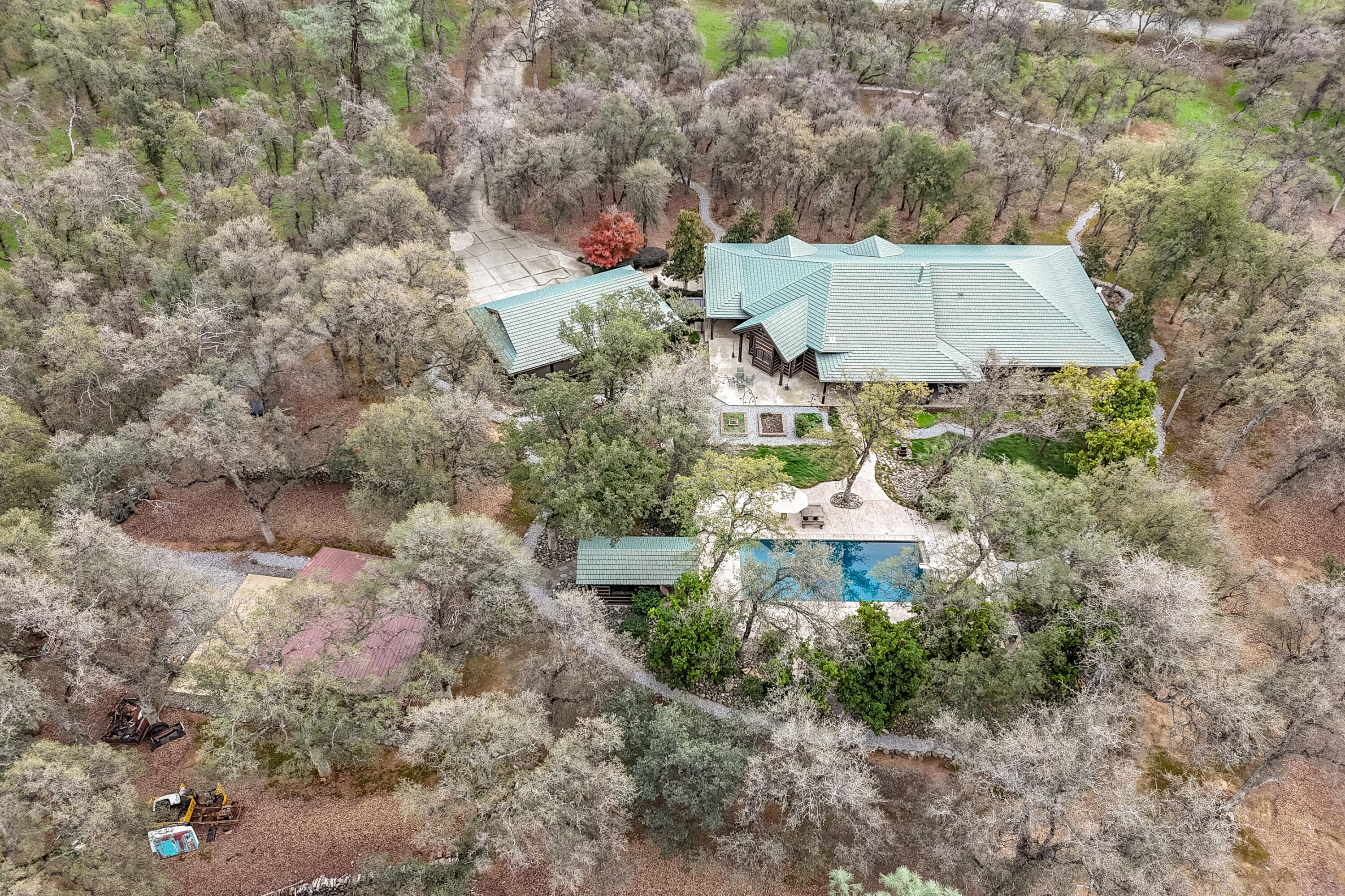 15900 El Camino Robles Road Redding, CA 96001 - Photo 116 of 117 a aerial view of a house with a yard and large trees