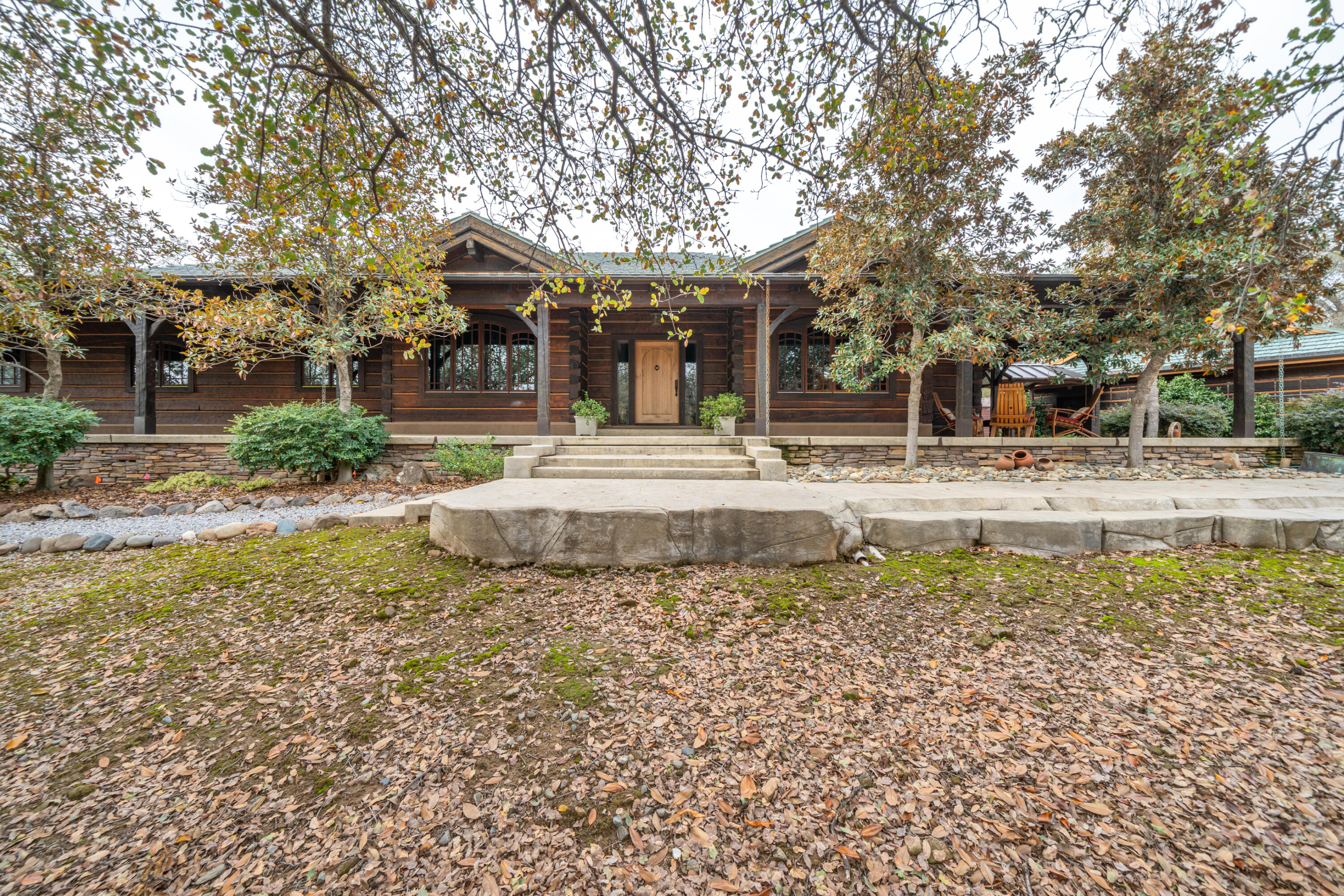 15900 El Camino Robles Road Redding, CA 96001 - Photo 2 of 116 a view of a house with a yard and sitting area