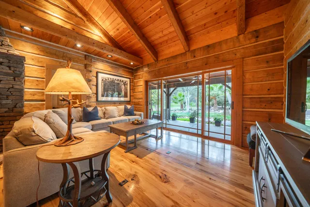 a view of yard with swimming pool and trees