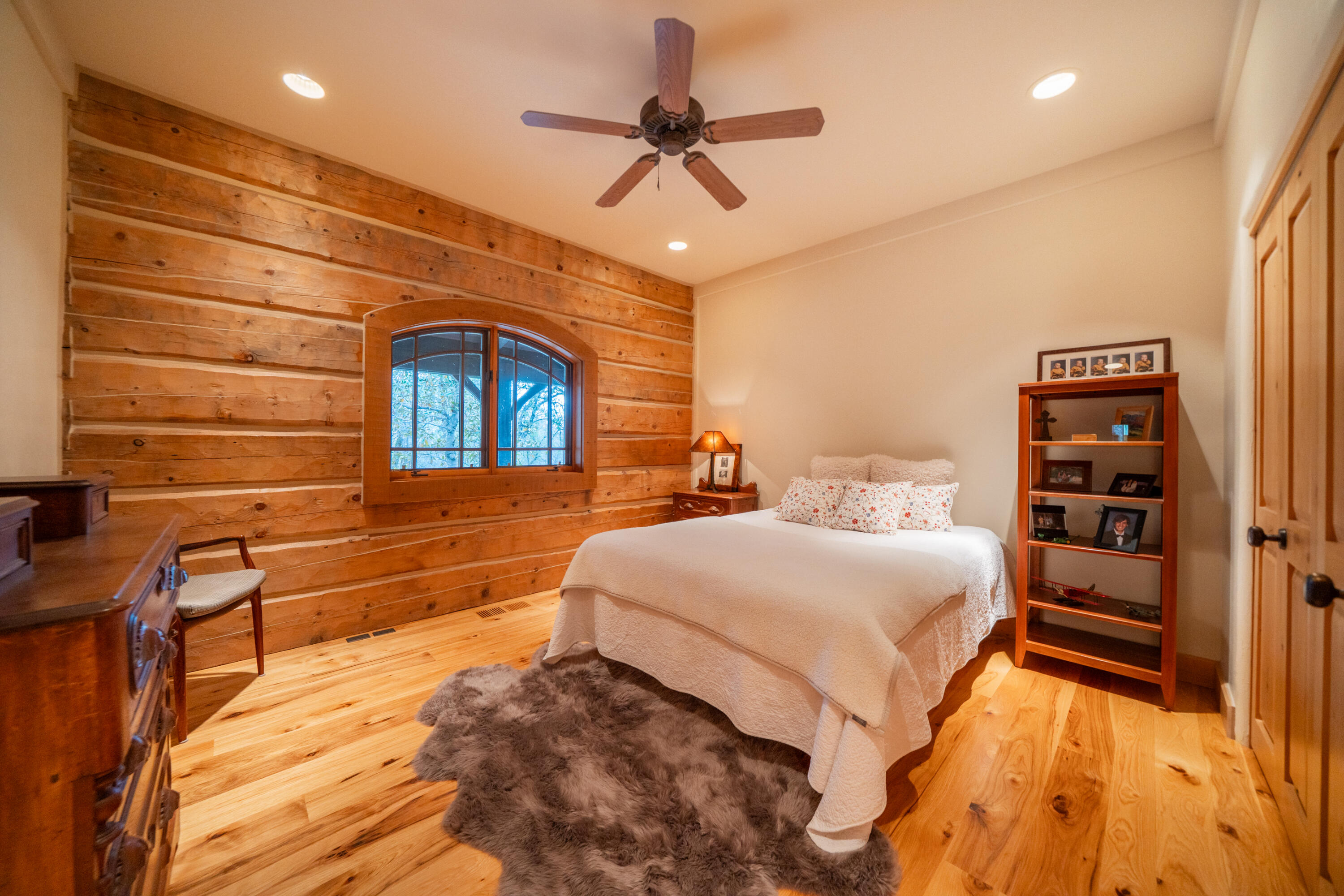 15900 El Camino Robles Road Redding, CA 96001 - Photo 42 of 117 a bedroom with a bed and a ceiling fan