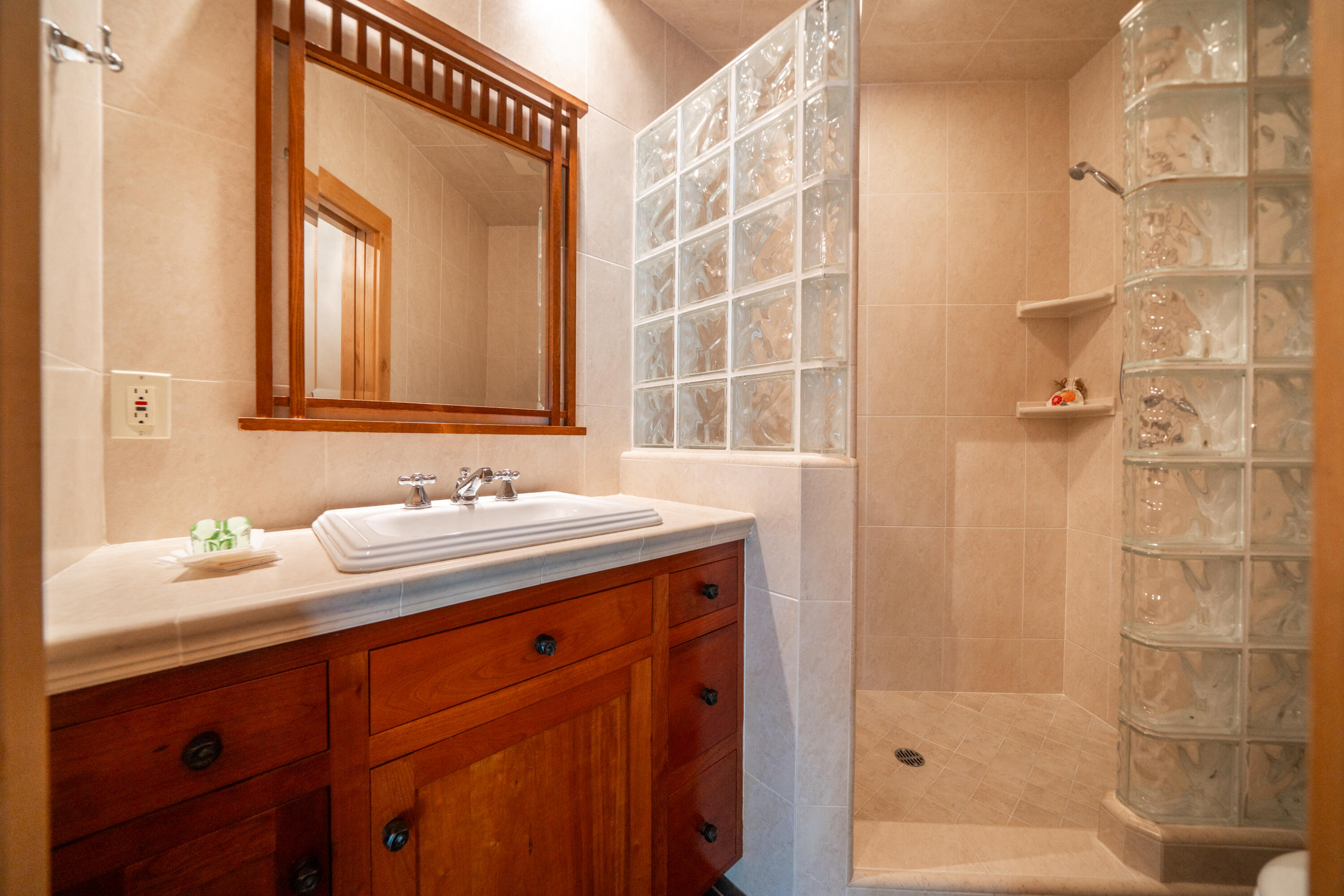 15900 El Camino Robles Road Redding, CA 96001 - Photo 48 of 116 a bathroom with a granite countertop sink and a mirror