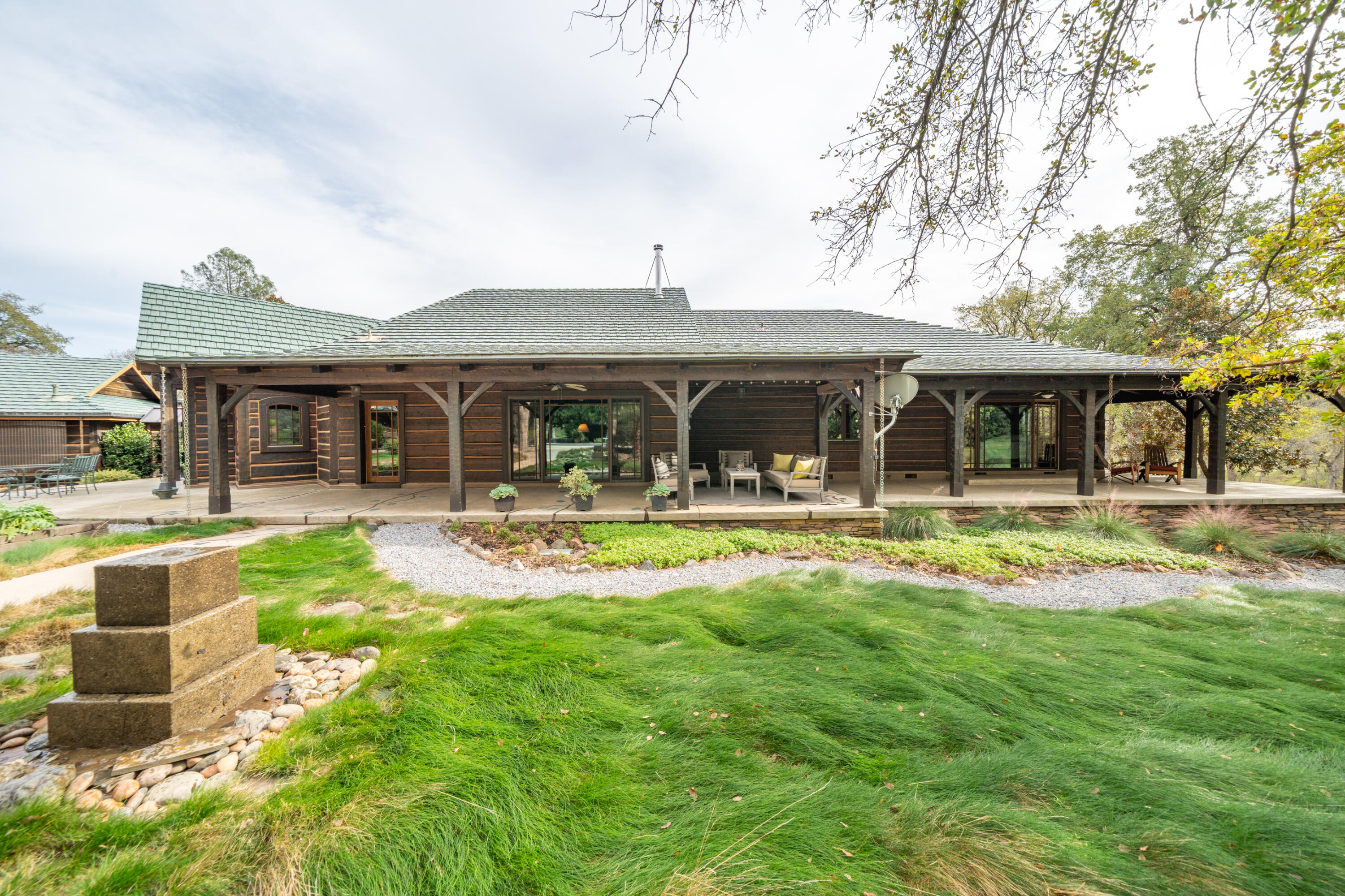 15900 El Camino Robles Road Redding, CA 96001 - Photo 66 of 117 a front view of a house with swimming pool having outdoor seating