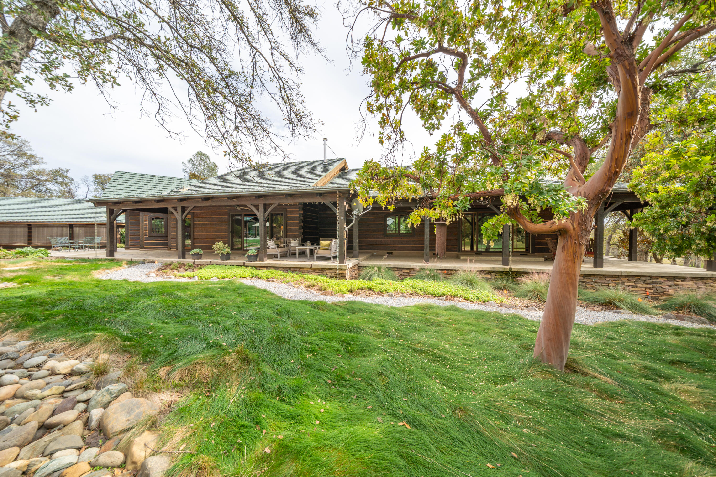 15900 El Camino Robles Road Redding, CA 96001 - Photo 70 of 117 a swimming pool with outdoor seating and yard