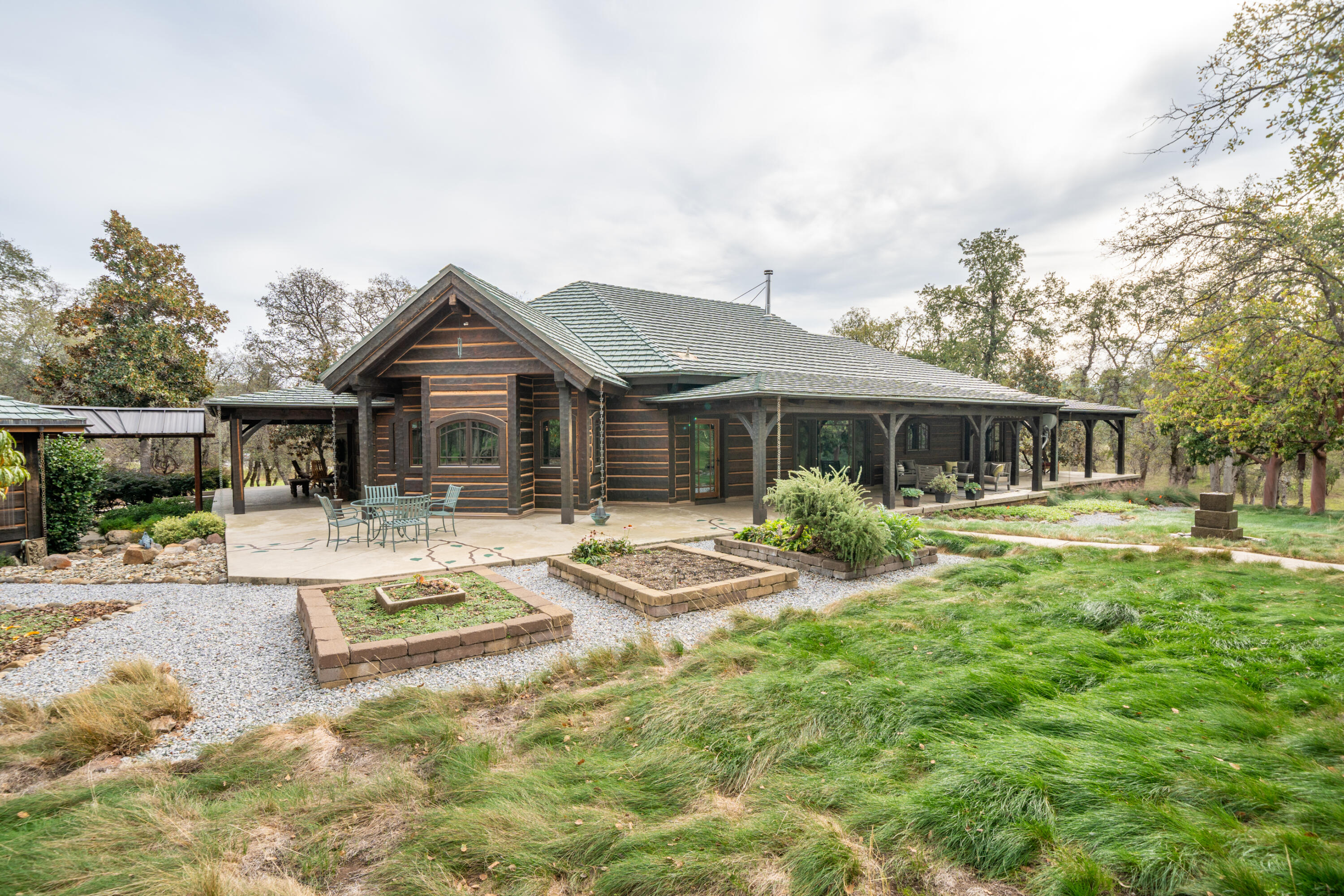15900 El Camino Robles Road Redding, CA 96001 - Photo 73 of 117 a front view of a house with a yard table and chairs