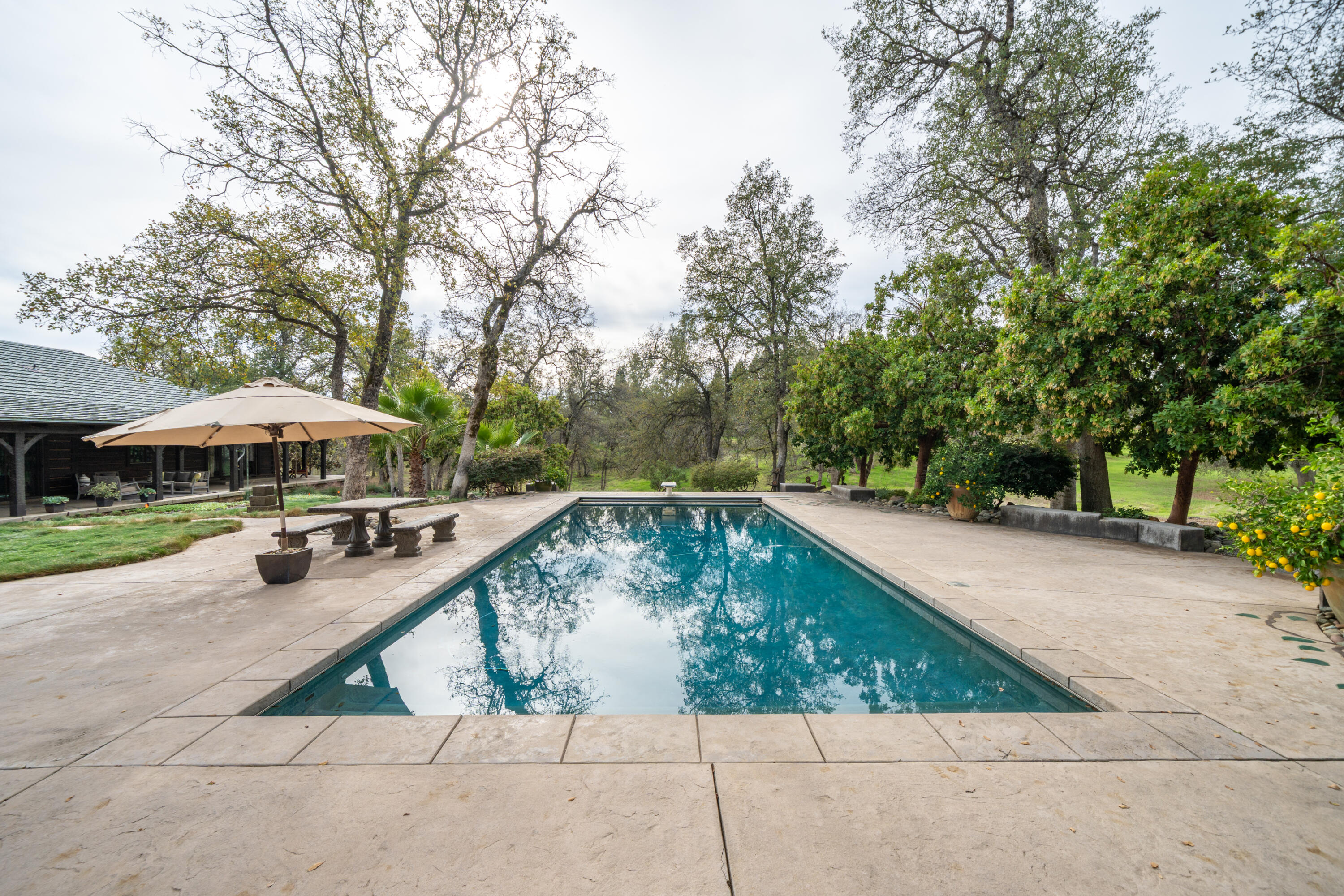 15900 El Camino Robles Road Redding, CA 96001 - Photo 80 of 117 a view of swimming pool with a patio
