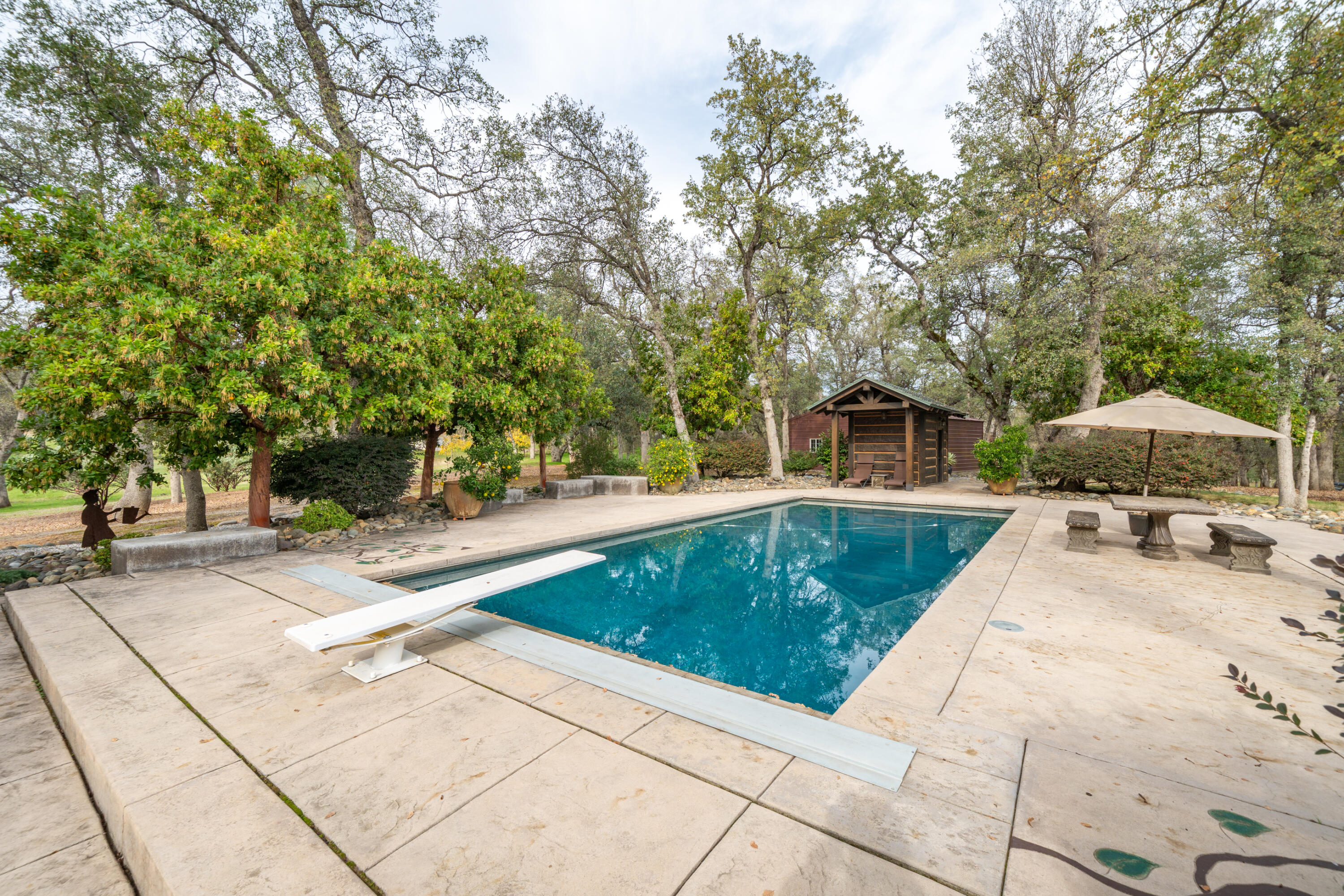 15900 El Camino Robles Road Redding, CA 96001 - Photo 83 of 117 a view of a swimming pool with a patio