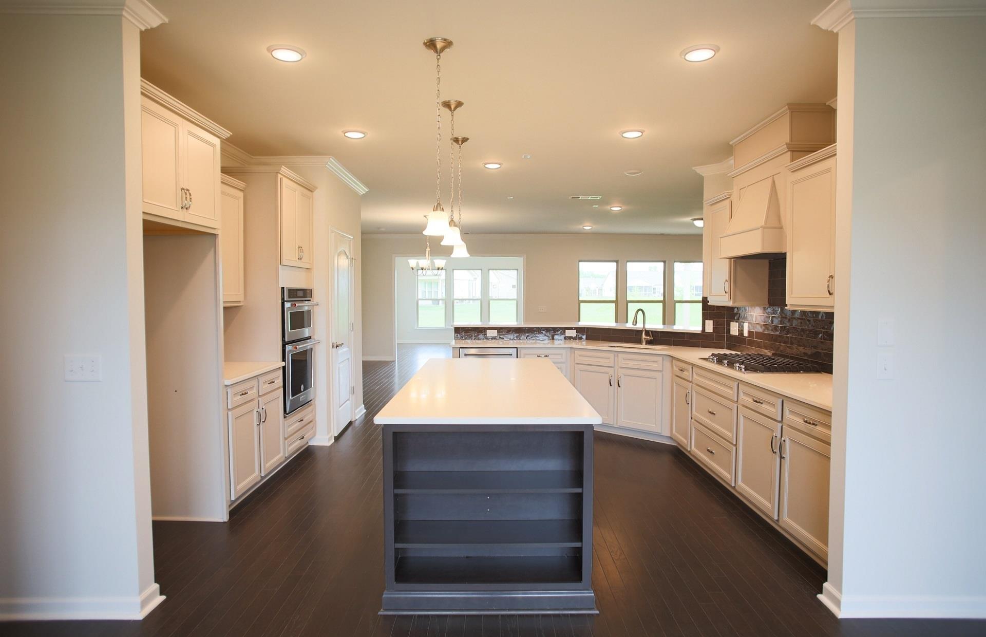 Gourmet Kitchen overlooking Gathering Room & Dining areas