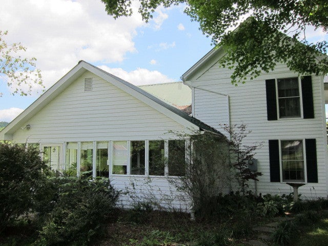 2025 Pete Lynch Road Secondcreek, WV 24974 - Photo 12 of 94 Side view of the home, Addition to home is on the left.