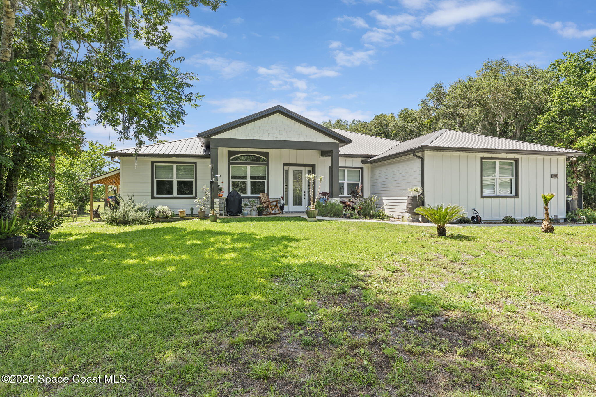 1740 Ford Road Mims, FL 32754 - Photo 2 of 43 a front view of house with yard and green space