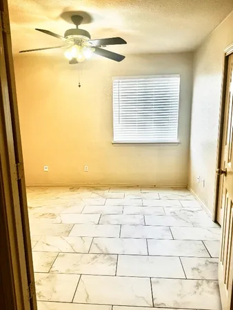a view of an empty room and window