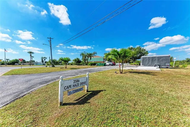 a swimming pool with outdoor seating and yard