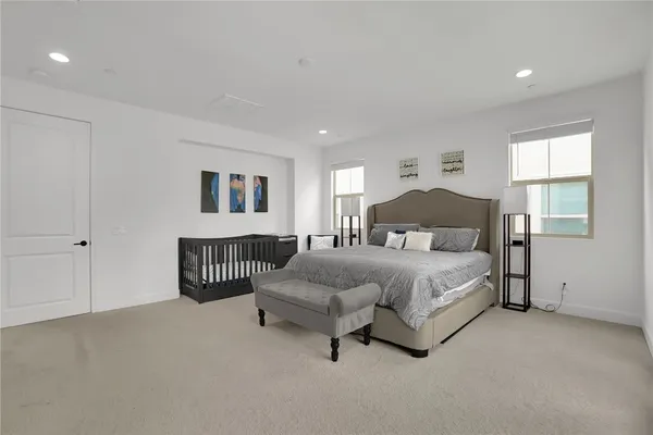 a bedroom with a bed and lamp