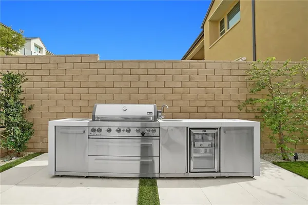 a stove top oven sitting inside of a kitchen