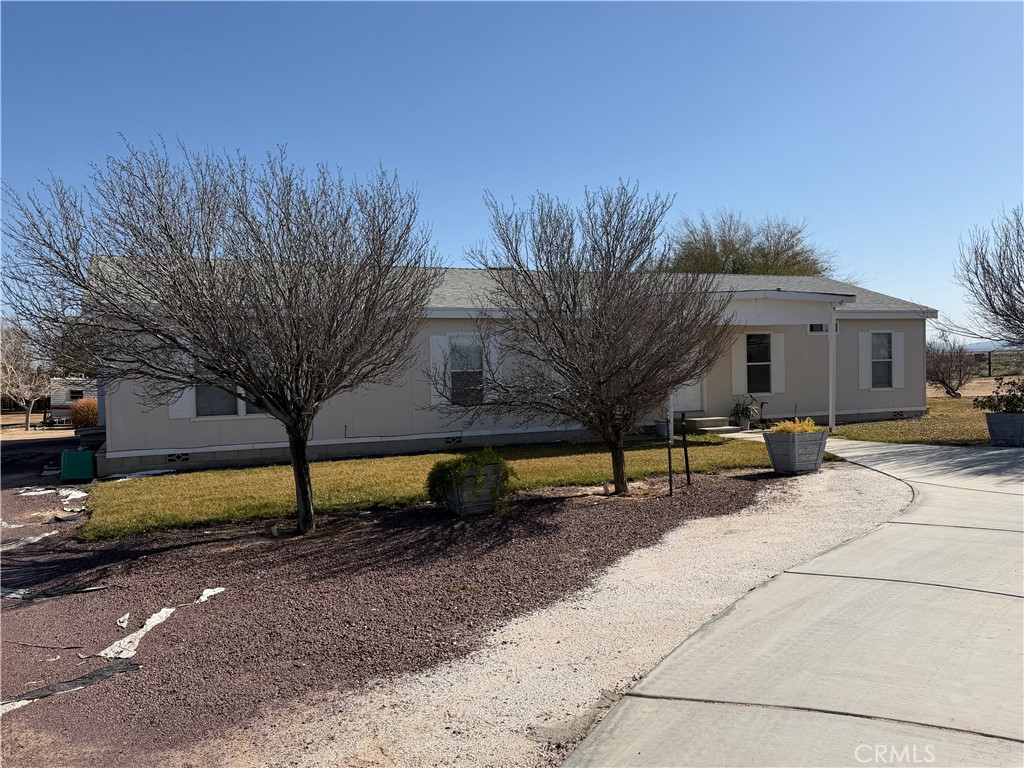 36633 Hidden River Road Hinkley, CA 92347 - Photo 2 of 19 a view of a house with a yard and sitting area