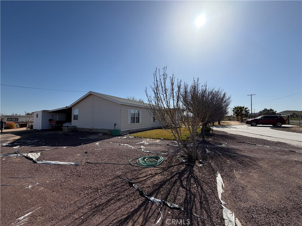 36633 Hidden River Road Hinkley, CA 92347 - Photo 3 of 19 a house view with a backyard space